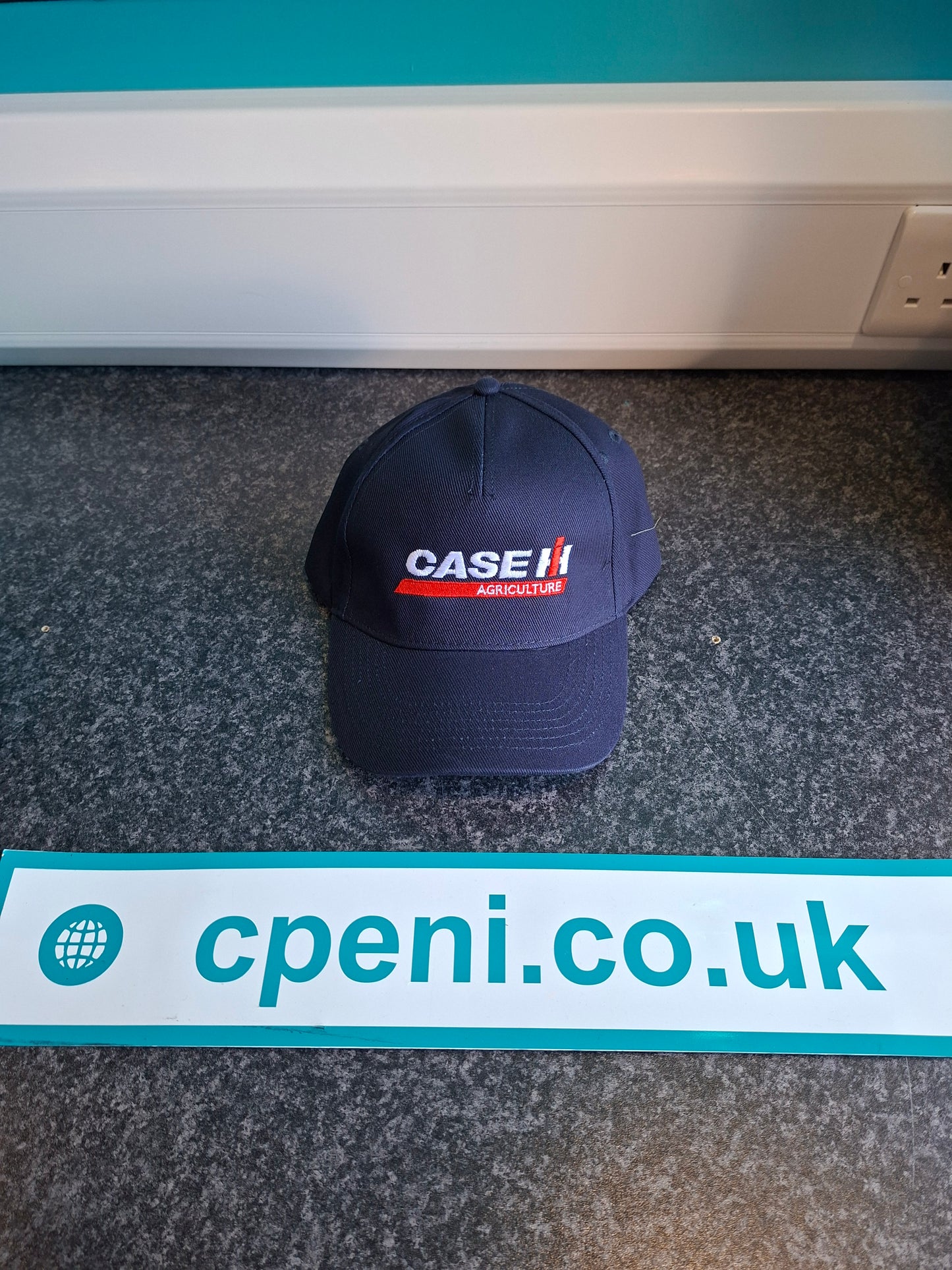 Navy base ball hat with case logo